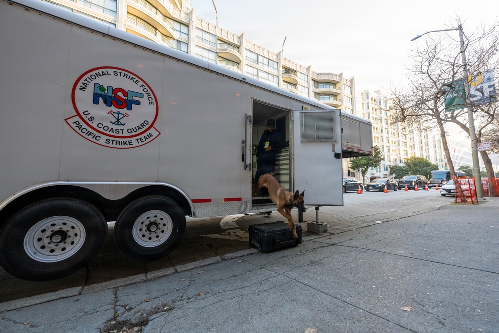 U.S. Coast Guard Maritime Safety and Security Team conduct K-9 sweeps in preparation for the Super Bowl.