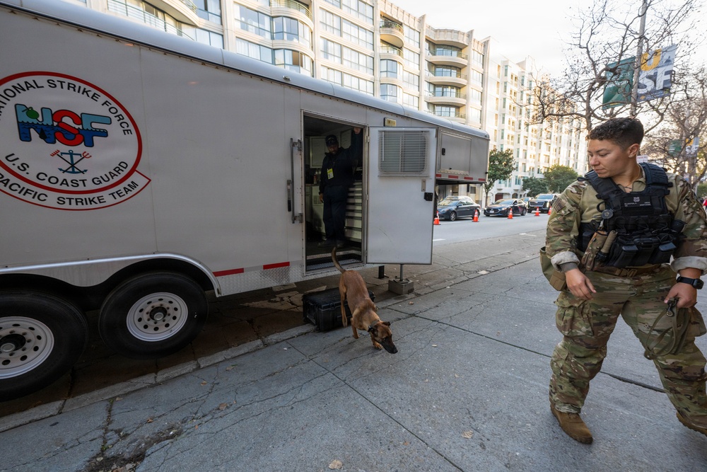 U.S. Coast Guard Maritime Safety and Security Team conduct K-9 sweeps in preparation for the Super Bowl.