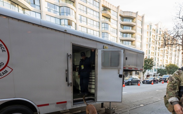 U.S. Coast Guard Maritime Safety and Security Team conduct K-9 sweeps in preparation for the Super Bowl.