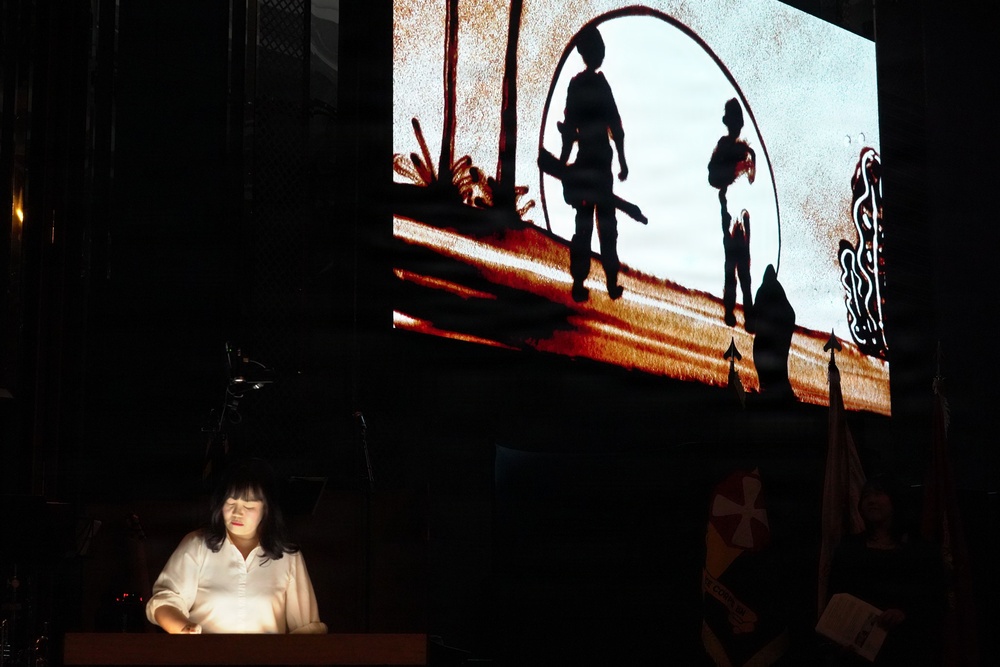 Sand art tells history of alliance