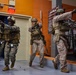 U.S. Marines with FAST Company Europe and Marine Security Guards conduct a emergency action test