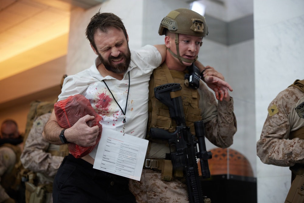 U.S. Marines with FAST Company Europe and Marine Security Guards conduct a emergency action test