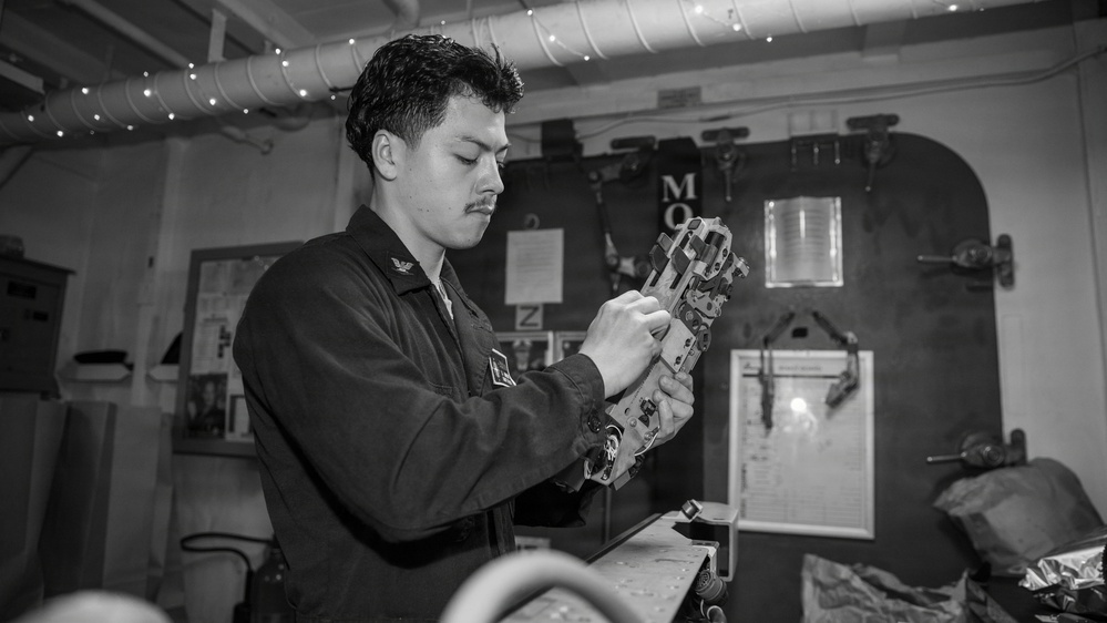 USS Gerald R. Ford (CVN 78) Sailor Inspects Component
