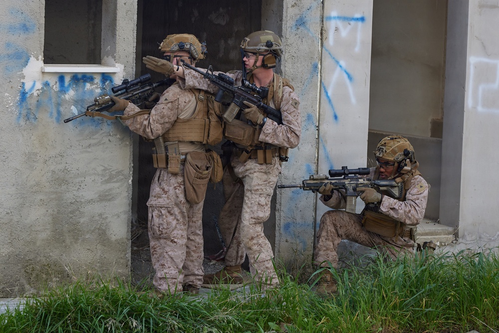 U.S. Marines with FAST Company Europe conduct live sim close quarter battle training