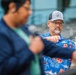 A Coast Guard Civilian lights a candle in rememberance of the victims of 9/11