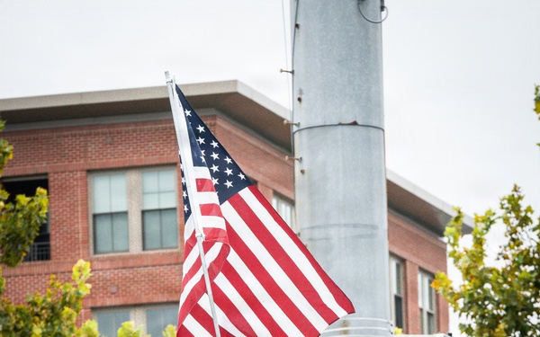 The American flag is held high while climbing the 110 flights of stairs