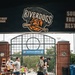 Participants run along the concorse of the Charleston RiverDogs stadium