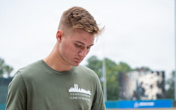 The event MC rings the bell for a moment of silence.