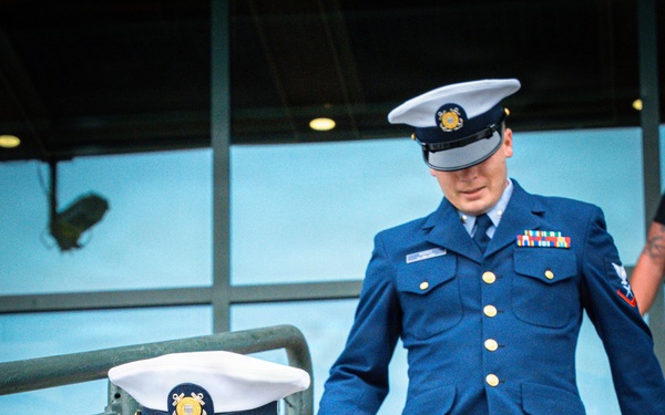Coast Guard members smiling during the 110 flight climb