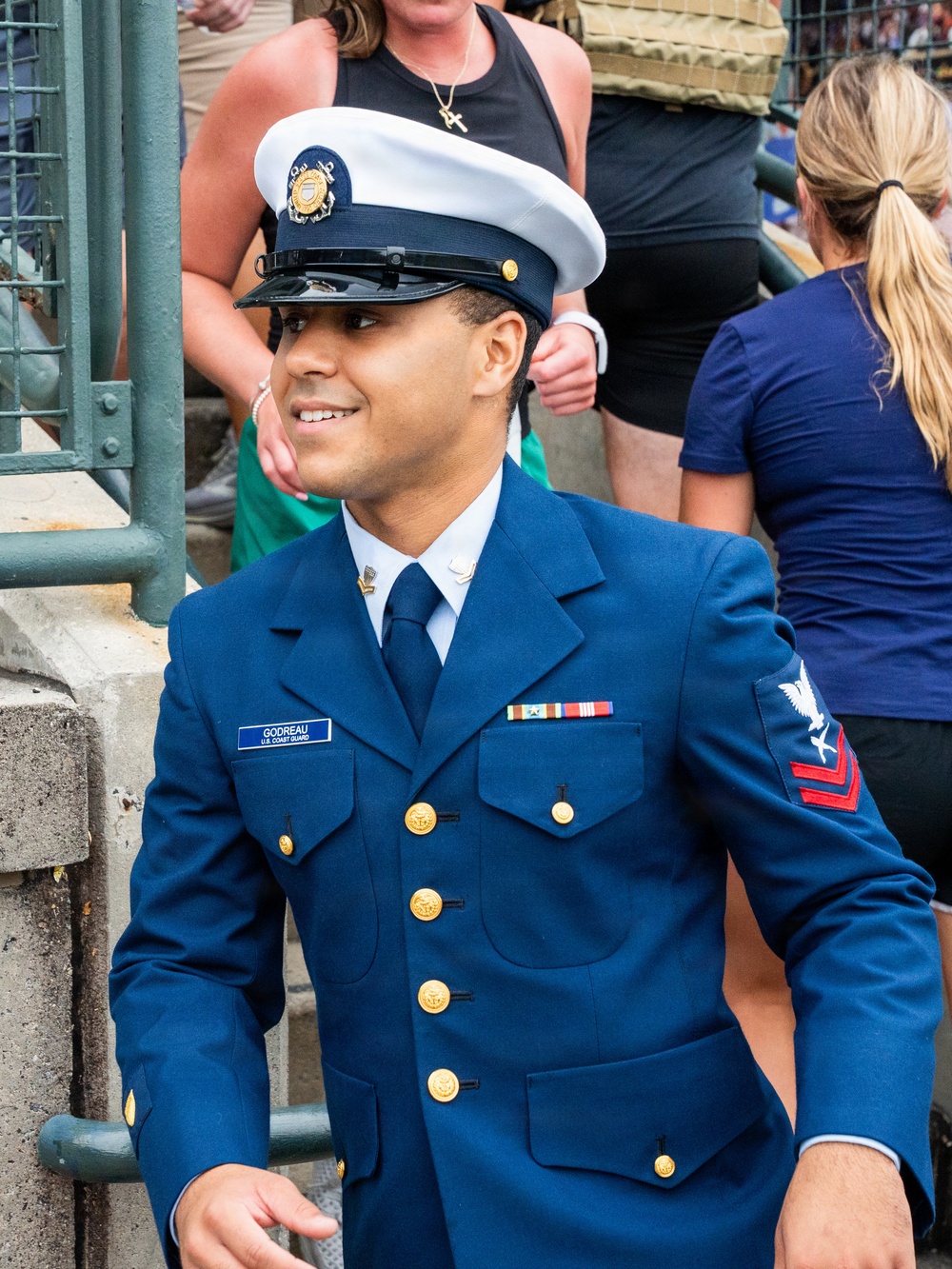 YN2 Luis Godreau smiles as he completes the equivalent of a 110-story climb in his bravo uniform