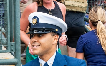YN2 Luis Godreau smiles as he completes the equivalent of a 110-story climb in his bravo uniform