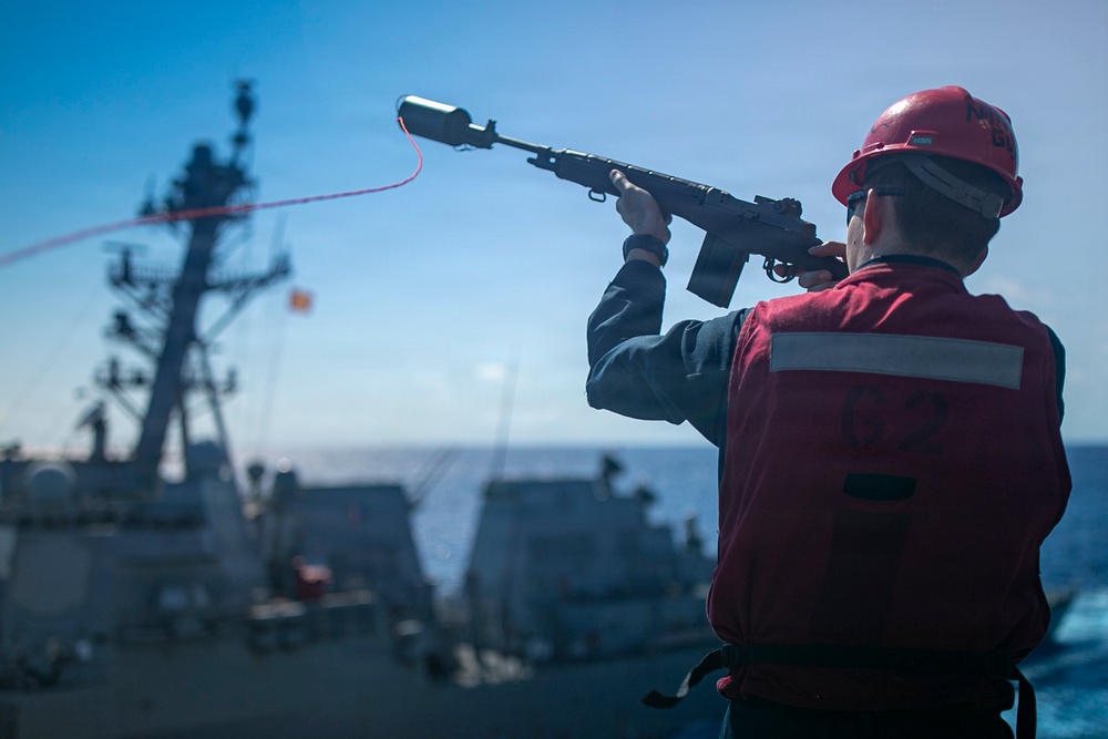 USS Tripoli Refuels USS Rafael Peralta At Sea