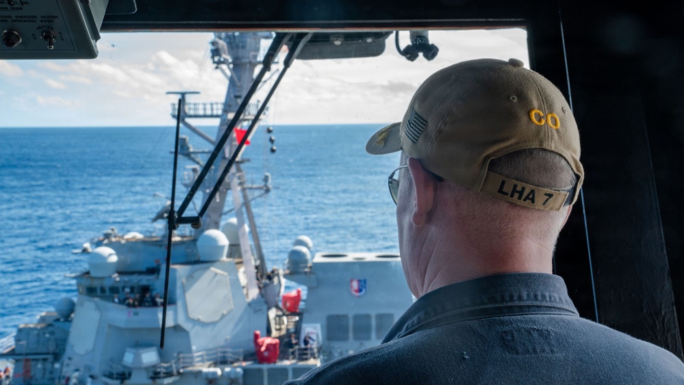 USS Tripoli Refuels USS Rafael Peralta At Sea