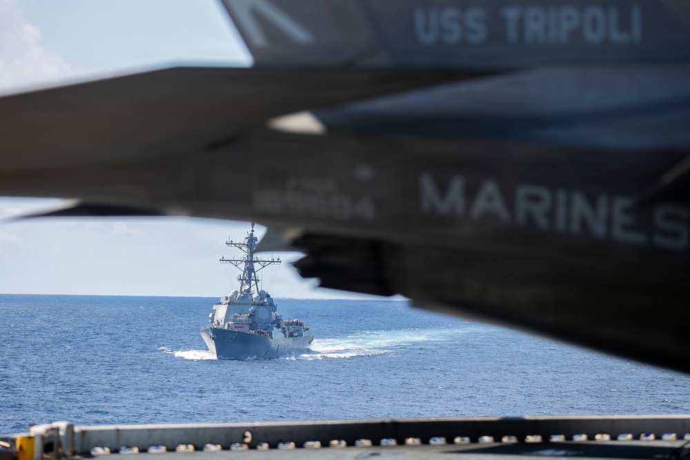 USS Tripoli Refuels USS Rafael Peralta At Sea