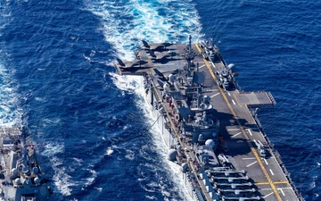 USS Tripoli Refuels USS Rafael Peralta At Sea