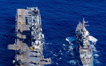 USS Tripoli Refuels USS Rafael Peralta At Sea