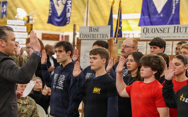Secretary of War Pete Hegseth administers the oath of enlistment military recruits in Rhode Island
