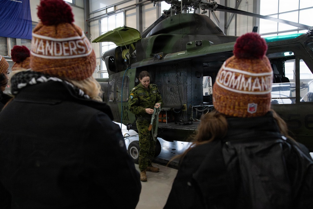 NFL Cheerleaders Receive a Safety Brief Before a Helicopter Flight