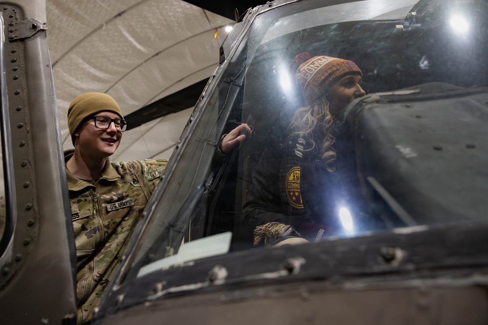 NFL Cheerleader a Receives Tour of a Helicopter