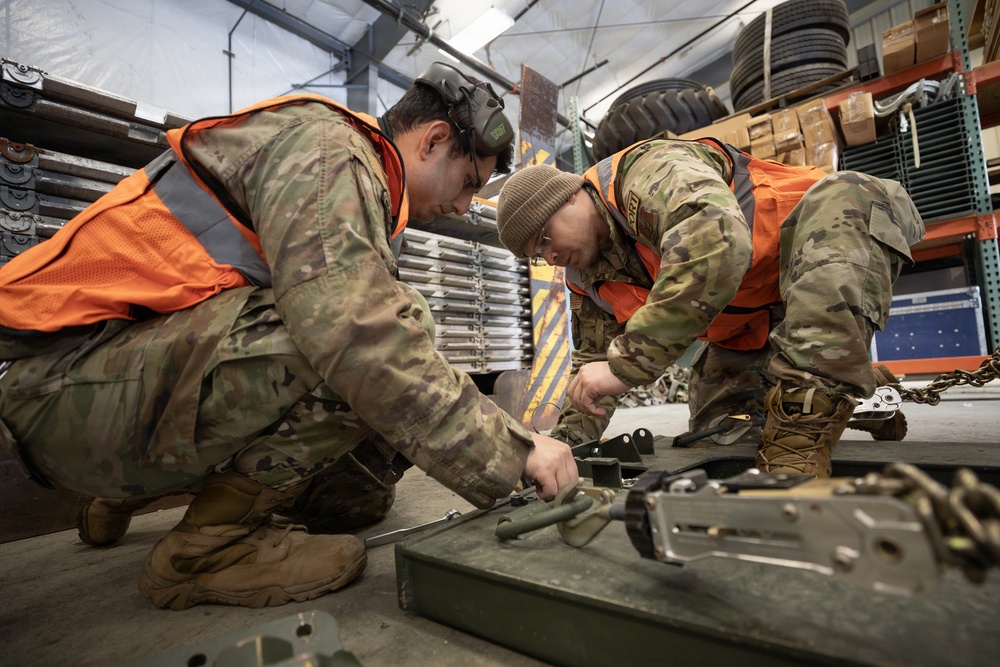 176th Wing air transportation specialists and loadmasters work together