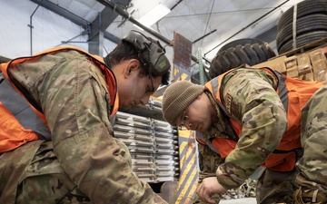 176th Wing air transportation specialists and loadmasters work together