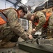 176th Wing air transportation specialists and loadmasters work together
