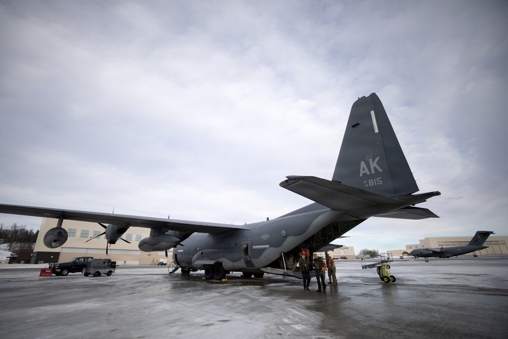 176th Wing air transportation specialists and loadmasters work together