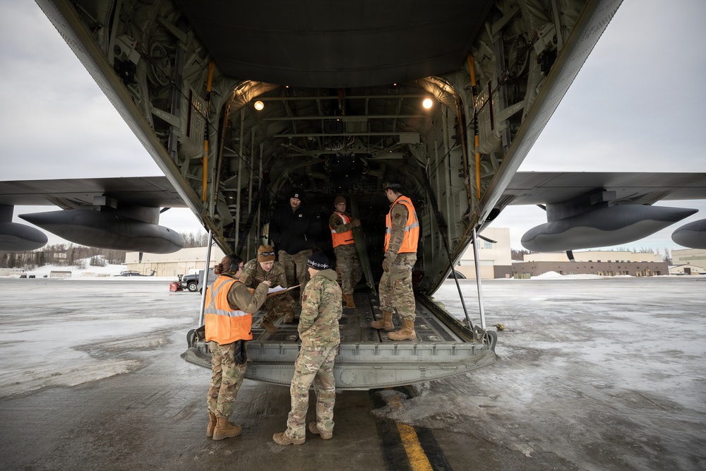 176th Wing air transportation specialists and loadmasters work together