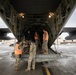 176th Wing air transportation specialists and loadmasters work together