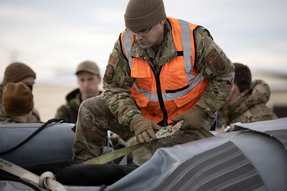 176th Wing air transportation specialists and loadmasters work together