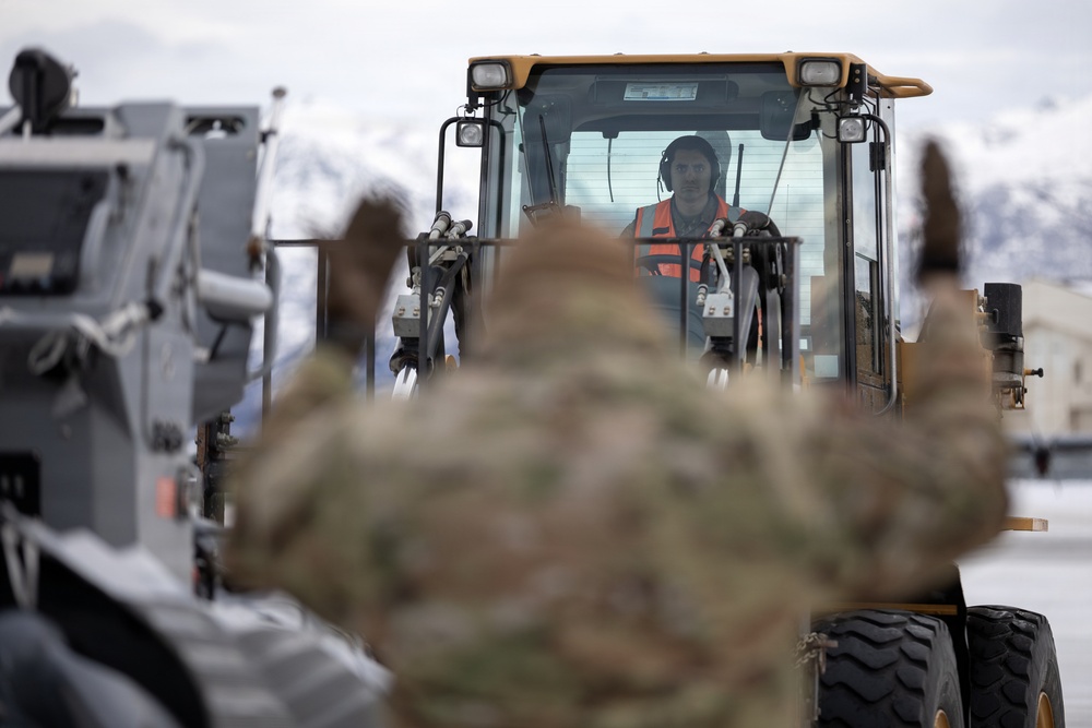 176th Wing air transportation specialists and loadmasters work together