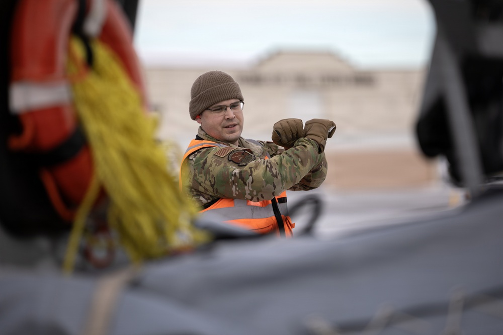 176th Wing air transportation specialists and loadmasters work together