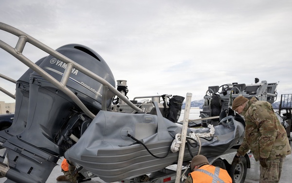 176th Wing air transportation specialists and loadmasters work together