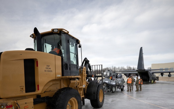 176th Wing air transportation specialists and loadmasters work together