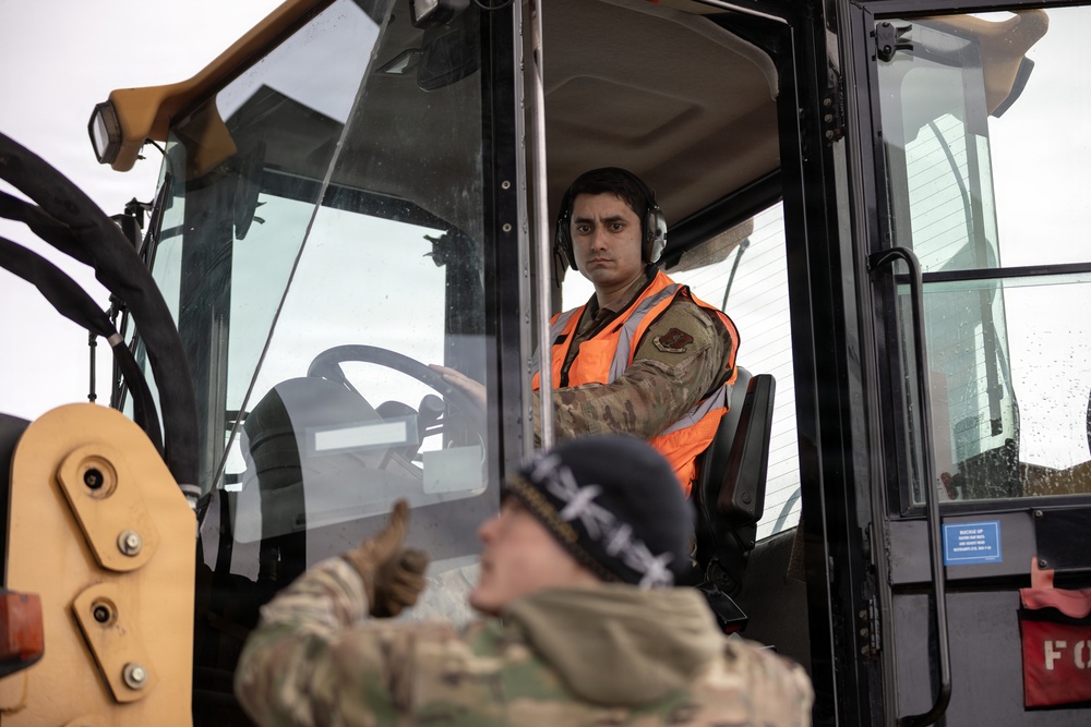176th Wing air transportation specialists and loadmasters work together