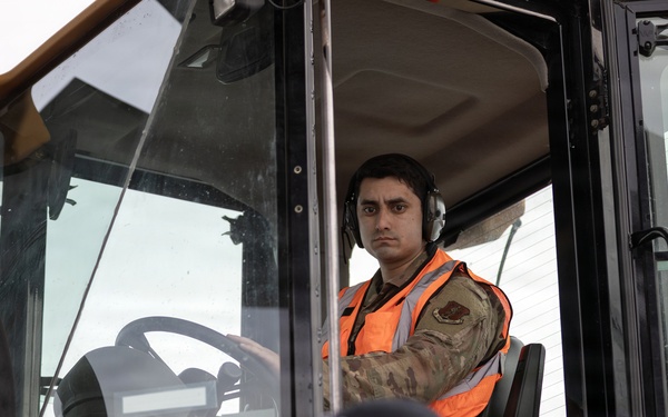 176th Wing air transportation specialists and loadmasters work together