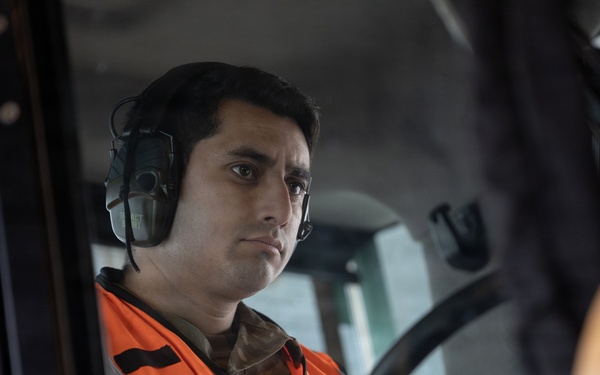 176th Wing air transportation specialists and loadmasters work together