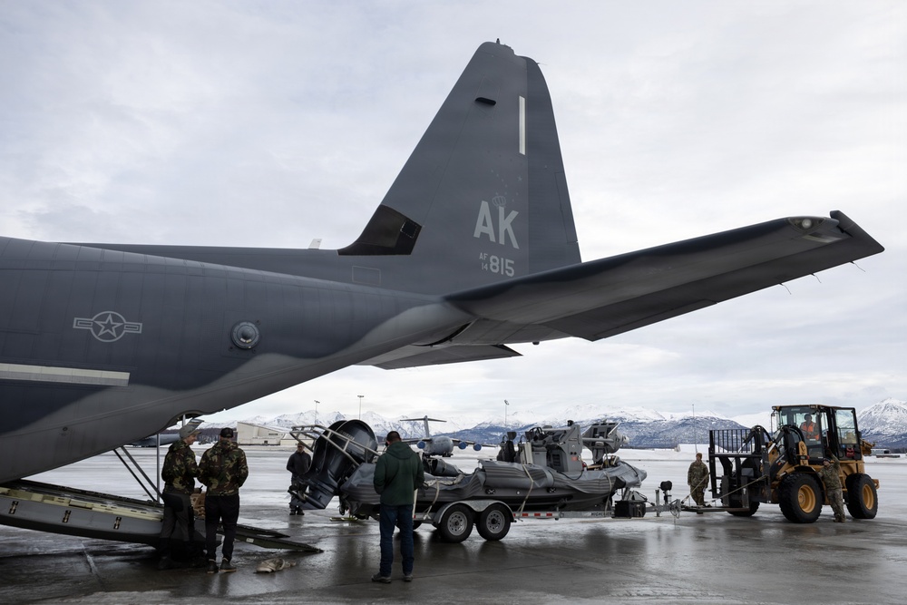176th Wing air transportation specialists and loadmasters work together