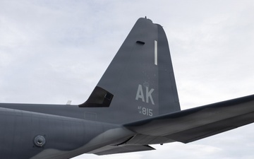 176th Wing air transportation specialists and loadmasters work together
