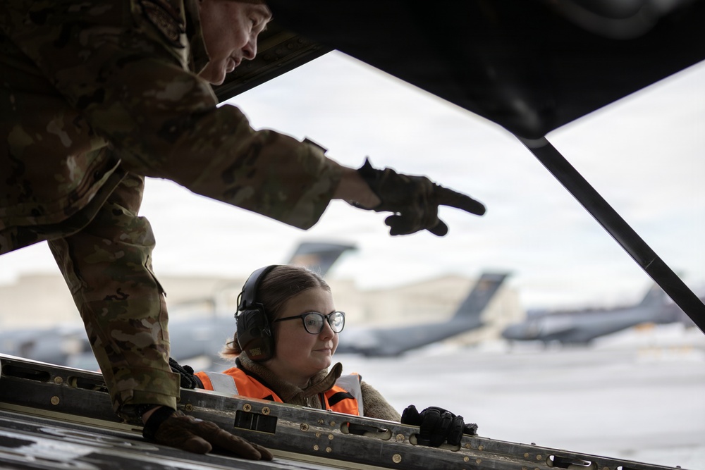 176th Wing air transportation specialists and loadmasters work together