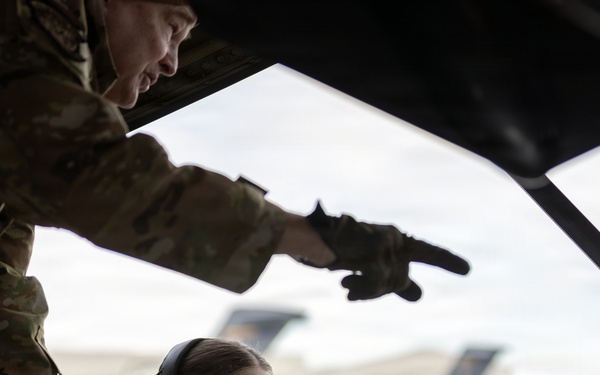 176th Wing air transportation specialists and loadmasters work together