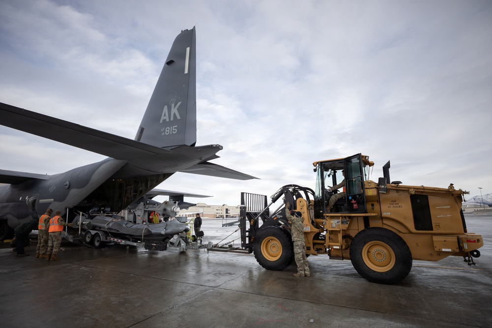 176th Wing air transportation specialists and loadmasters work together