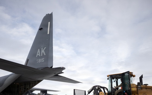 176th Wing air transportation specialists and loadmasters work together