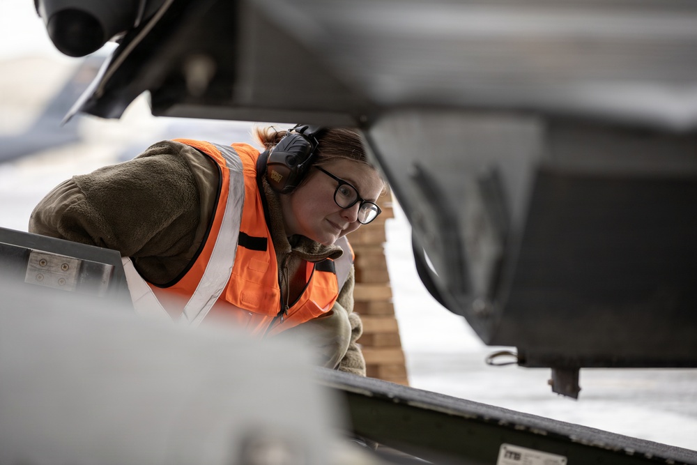 176th Wing air transportation specialists and loadmasters work together