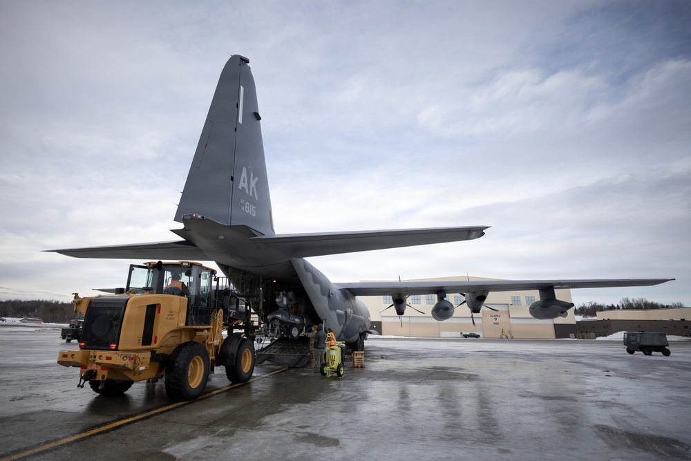 176th Wing air transportation specialists and loadmasters work together