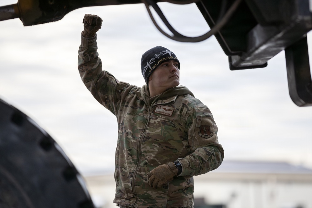 176th Wing air transportation specialists and loadmasters work together
