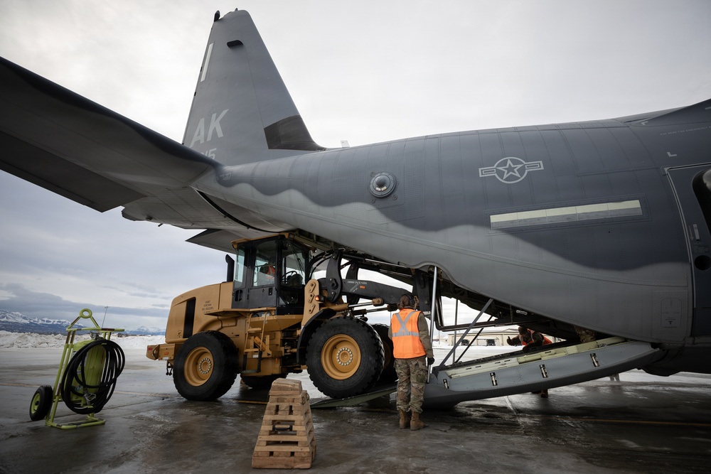 176th Wing air transportation specialists and loadmasters work together