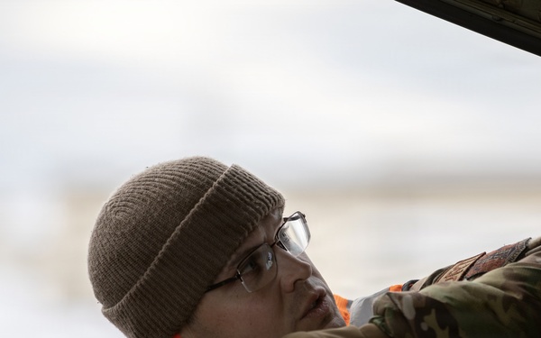 176th Wing air transportation specialists and loadmasters work together