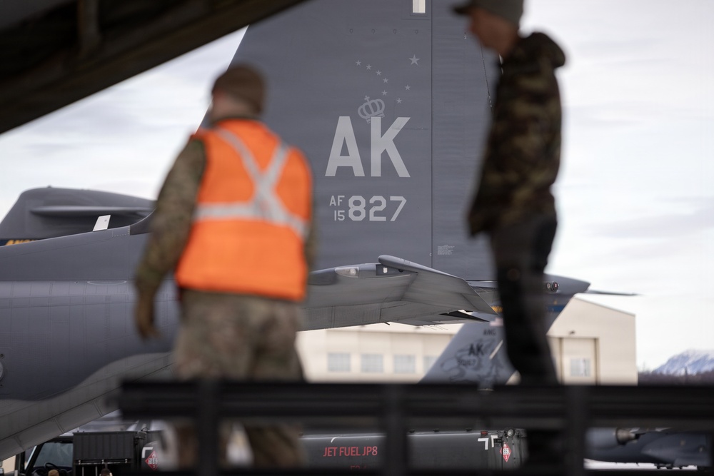 176th Wing air transportation specialists and loadmasters work together