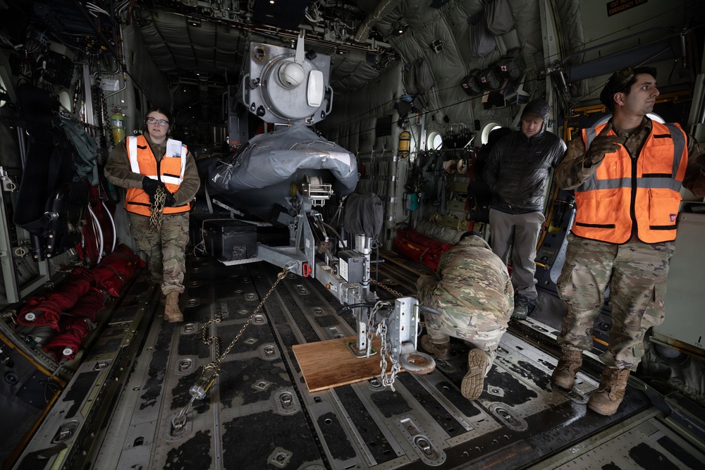 176th Wing air transportation specialists and loadmasters work together